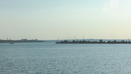 Seascape with yachts on the horizon