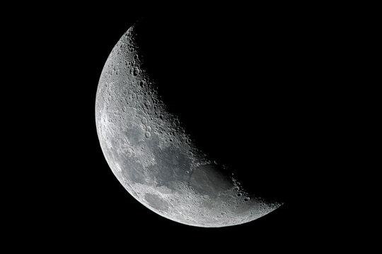 Waxing crescent moon as seeing from the southern hemisphere. Amazing the moon rough surface full of craters from meteorites coming from the universe and crashing our satellite the Moon an awe relief