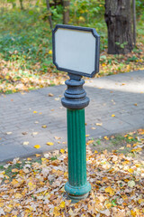 Iron street sign without signs and symbols during the day
