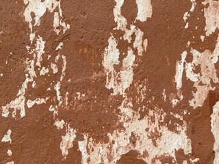 Dark Red Plastered Wall With Dirty Red Brown Scratched Horizontal Background. Aged weathered red street wall background. Retro Vintage Messy And Cracked Rusty Wallpaper. Abstract Web Banner.