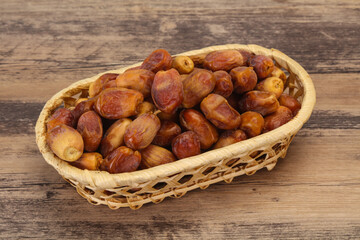 Sweet tasty dry dates in the basket