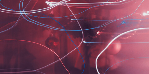 Christmas decor and festive lights in motion. Neon effect lines. Modern abstract festive blur background