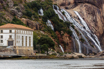 Castrelo and Ézaro Waterfall Hydroelectric Plant, Dumbría, La Coruña, Galicia, Spain. Building...