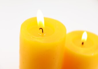 yellow candles on a white background