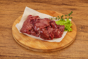 Raw chicken liver over board