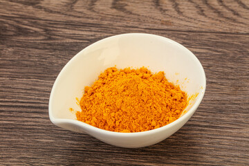 Tumeric powder in the bowl