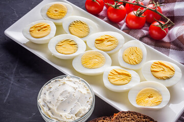 boiled chicken eggs on a dark stone background