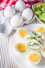boiled chicken eggs on a white wooden rustic background