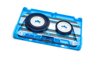 old blue audio cassette tape on white background