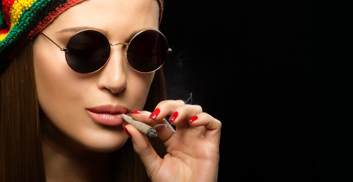 Attractive Hippie Young Woman Smoking Marijuana