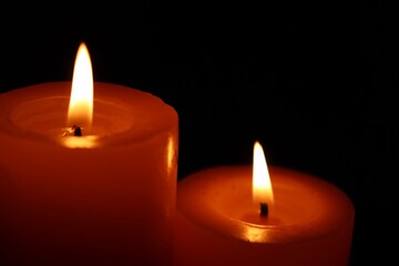 Candle black background of mourning funeral moment of silence