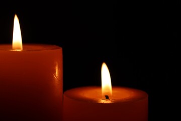 Candle black background of mourning funeral moment of silence