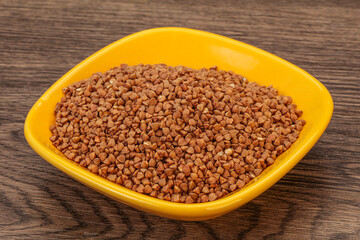 Raw buсkwheat cereal in the bowl