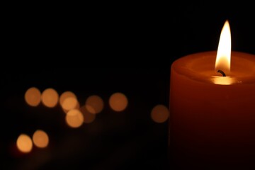 Candle black background of mourning funeral moment of silence