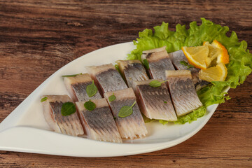 Herring fillet with sliced lemon