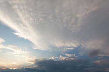Naklejka na ściany i meble cloudy blue sky at sunset, use as a background or texture