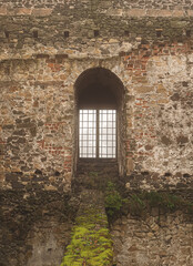Fototapeta na wymiar View on an aged medieval castle in a fog