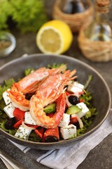 Greek salad with grilled shrimps. Healthly food.