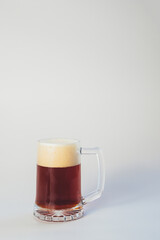 mug of dark beer on a white background
