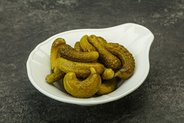Pickled gherkin in the bowl