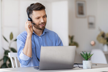 Hotline Operator. Portrait Of Call-Center Employee Wearing Headset At Workplace In Office