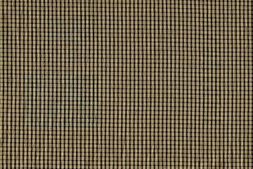 The texture of natural fabric in a small cage of brown, khaki. Natural cotton in a small cage.