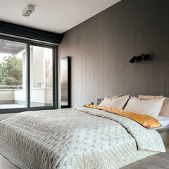 Elegant master bedroom with balcony
