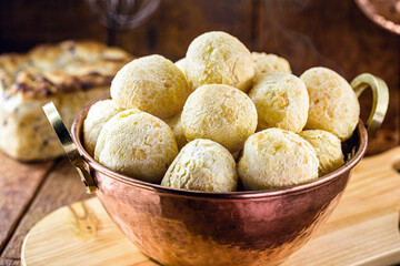 cheese bread, bread made from baked cheese common in latin america, on rustic wooden background