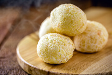 Fototapeta na wymiar cheese bread, bread made from baked cheese common in latin america, on rustic wooden background