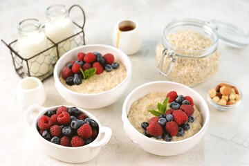 Oatmeal with fresh blueberries and raspberries. Healthy breakfast.