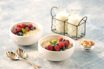 Oatmeal with fresh blueberries and raspberries. Healthy breakfast.