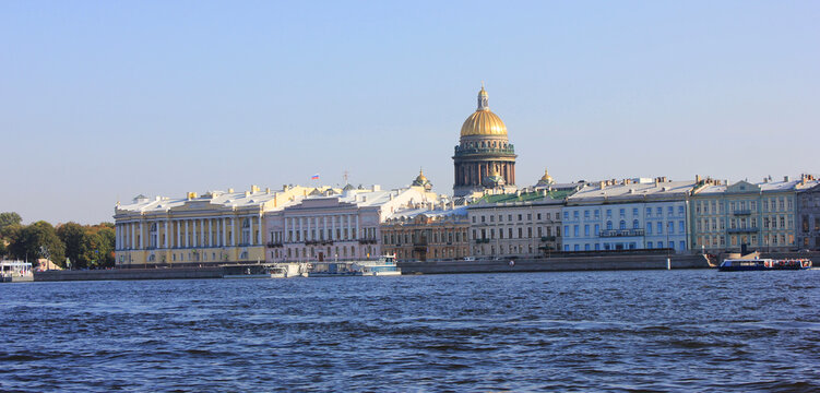 Saint Petersburg cityscape view with Neva river embankment and Saint Isaac's cathedral architecture on sunny day. Architecture of St Petersburg city center, historic landscape scenic view