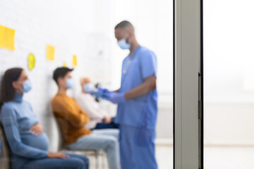 Covid-19 Patients Talking With Doctor In Hospital, Blurred Background