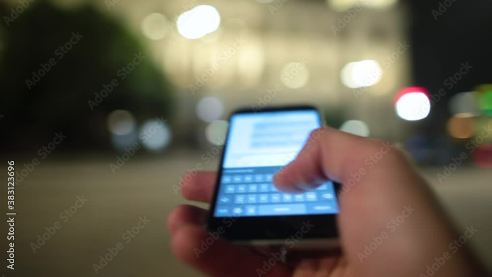 Poster close-up of writing a message on the phone in motion. the finger of the hand presses on the letters 
