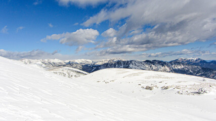 Fototapeta na wymiar Sunny and snowy winter day in the spanish Pyrenees mountains. Landscape with snow and blue sky.