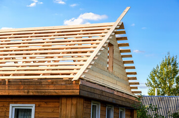 Construction new roof of a wooden house