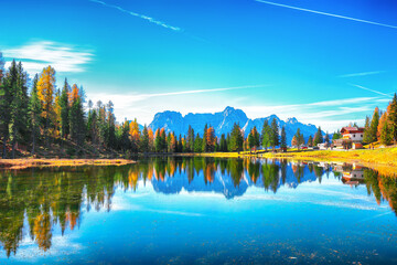 Stunning view of popular travel destination mountain lake Antorno in autumn