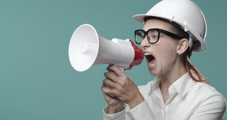 Aggressive businesswoman shouting through a megaphone - Powered by Adobe