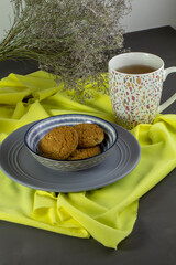oatmeal cookies and a cap of tea