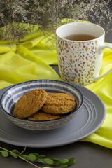 oatmeal cookies and a cap of tea