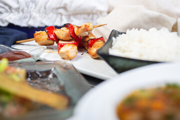 Top view of a restaurant table served with a multi-course set lunch and drink. Complex lunch.