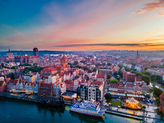 Fototapeta premium Aerial sunset view of the amazing old town and rivers of Gdansk with ships