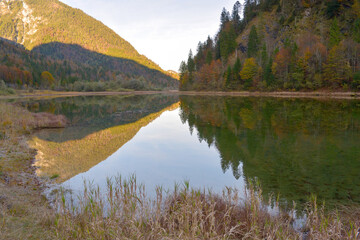 Autumn at lake Weitsee at nature reserve eastern Chiemgau alps, Bavaria, Germany
