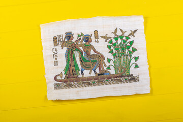 Fototapeta premium Retro style wood background painted yellow. Close-up. Cigarette.