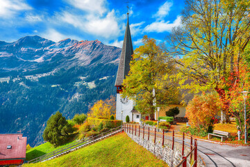 Awesome autumn view of picturesque alpine village Wengen.