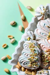 Airy meringue dessert with nuts. French dessert Meringue. Homemade colored meringue.