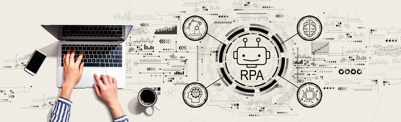 Obraz na płótnie Canvas Robotic Process Automation RPA theme with person using a laptop computer