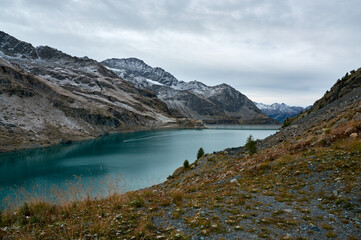 turquoise mountain lake in early autumn morning