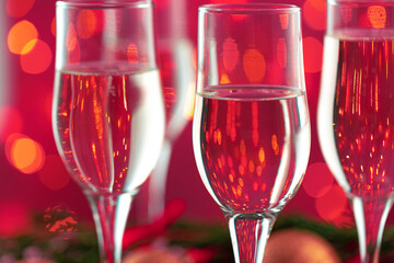 Close up photo of Champagne glasses against bokeh background