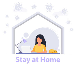 Girl working at her desk on a computer at home, working at home, studying. Coronavirus.